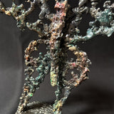 Sculpture de Philippe Buil représentant un papillon en dentelle de métal, symbole de légèreté et de transformation.