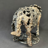 Sculpture contemporaine d'un rhinocéros en dentelle de métal acier et bronze par l'artiste sculpteur Philippe Buil vue de dos