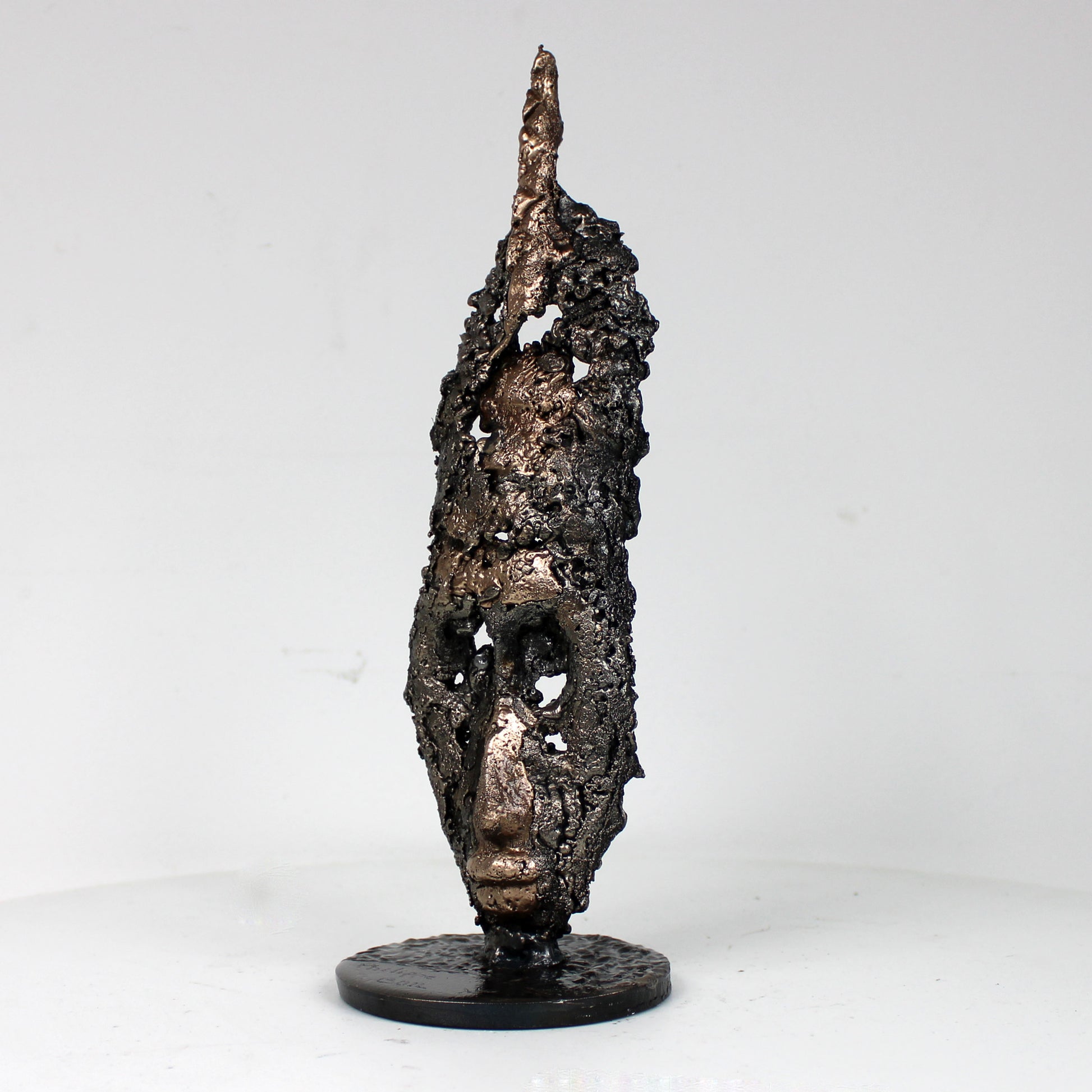 Sculpture visage africain stylisé acier bronze