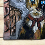 Tableau mural de 25×25 cm représentant un chat à béret dans un décor urbain gris et texturé. L’œuvre est réalisée en métal découpé avec des zones de dentelle de métal et colorée avec des pigments, créant un effet expressif et contrasté.
